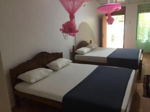 Postel nebo postele na pokoji v ubytování Margosa Guesthouse