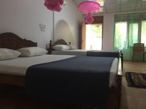 Postel nebo postele na pokoji v ubytování Margosa Guesthouse
