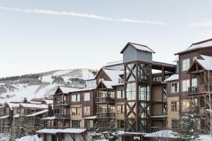 a large apartment building with snow on the ground at Silver Star #902 - 3 Bed TH in Park City