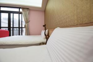 Postel nebo postele na pokoji v ubytování Catt Leya B&B Hotel