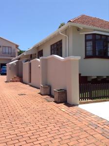 a house with a brick driveway in front of it at Broadway in Durban