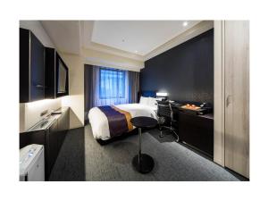 Postel nebo postele na pokoji v ubytování Daiwa Roynet Hotel Ginza PREMIER + 37 fotografií