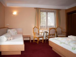 Uma cama ou camas num quarto em Pension Handle