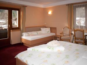 Uma cama ou camas num quarto em Pension Handle