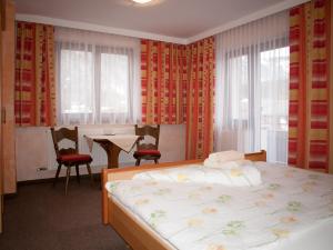 Uma cama ou camas num quarto em Pension Handle