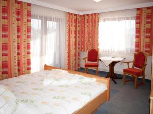 Uma cama ou camas num quarto em Pension Handle