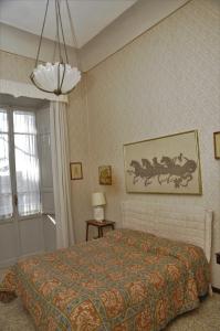 En eller flere senger på et rom på B&B Villa Gualterio