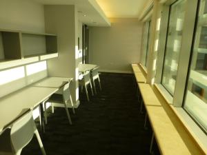 a row of tables and chairs in a room at Torquay House (Royal Oak) in London