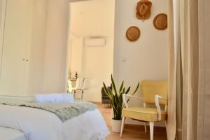 Katil atau katil-katil dalam bilik di Hola Valencia - Holiday Apartments