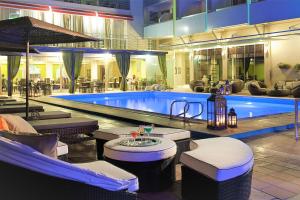 a pool in a hotel with a swimming pool at Congo Palace in Athens