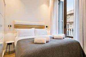 Postel nebo postele na pokoji v ubytování Vale Suites