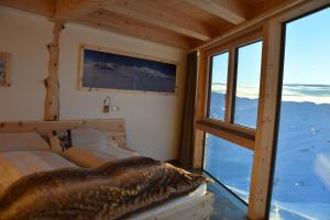 Ein Bett oder Betten in einem Zimmer der Unterkunft Lodge am Krippenstein