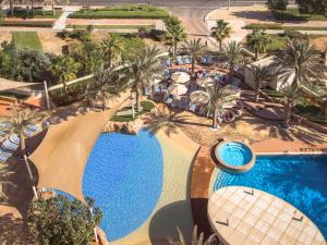 an overhead view of a swimming pool at a resort at Yas Island Rotana Abu Dhabi in Abu Dhabi