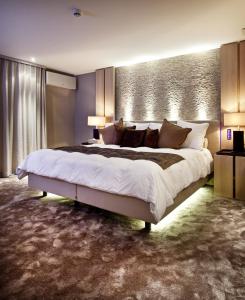 Ein Bett oder Betten in einem Zimmer der Unterkunft Hotel Thermen Dilbeek