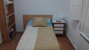 Cama o camas de una habitación en Pension Santa Rita