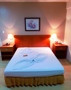 Postel nebo postele na pokoji v ubytování Geneviee Palace Hotel + 37 fotografií