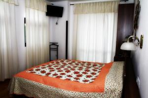 Un pat sau paturi într-o cameră la La Conac