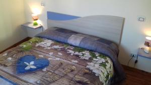 Voodi või voodid majutusasutuse Albergo Caprile toas
