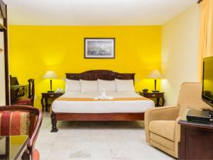Postel nebo postele na pokoji v ubytování Hotel Madan Cárdenas