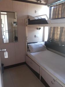 
A bed or beds in a room at Apollo Guest House
