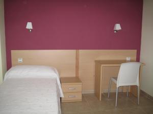 Postel nebo postele na pokoji v ubytování Hostal Ducal