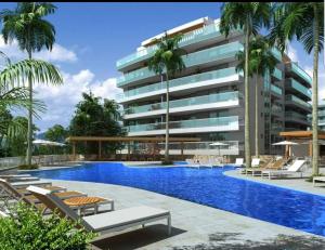 an image of an apartment building with a swimming pool at Le Bon Vivant 108 in Arraial do Cabo