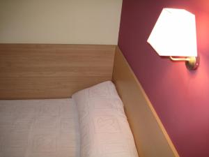 Postel nebo postele na pokoji v ubytování Hostal Ducal