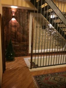 a staircase in a room with a wooden wall at Il Peschio in Pescocostanzo