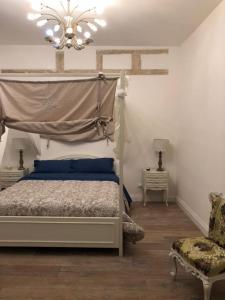 Cama ou camas em um quarto em Palazzo Siena De Facendis