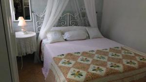 Posteľ alebo postele v izbe v ubytovaní Casa sul Mare vicino Marzamemi
