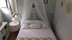 Ένα ή περισσότερα κρεβάτια σε δωμάτιο στο Casa sul Mare vicino Marzamemi
