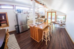 a kitchen with a counter and a refrigerator at Monarch Motel in Moscow
