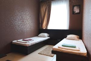 Postel nebo postele na pokoji v ubytování Hotel 8th Mile