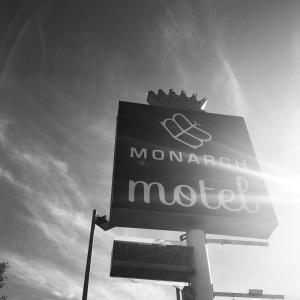 a sign for a moroccan motel on a pole at Monarch Motel in Moscow