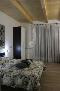 a bedroom with a bed with pillows on it at the Mainstreet in Agerola