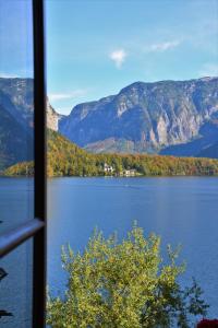 a view of a lake from a window at Haus Franziska in Hallstatt
