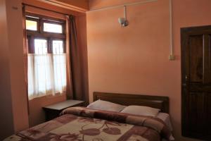 Postel nebo postele na pokoji v ubytování Deki Lodge