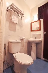 a bathroom with a toilet and a sink at Tuna Bay Island Resort in Perhentian Islands