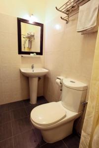 a bathroom with a toilet and a sink at Tuna Bay Island Resort in Perhentian Islands