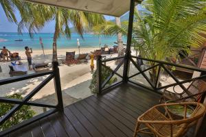 a porch with a view of the beach at Tuna Bay Island Resort in Perhentian Islands