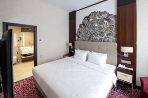 Postel nebo postele na pokoji v ubytování Bashkiria Hotel