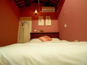 Postel nebo postele na pokoji v ubytování Zhu Shan Homestay