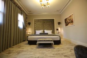 A bed or beds in a room at L'Agora Old Town Hotel & Bazaar