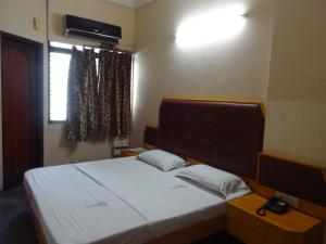Ένα ή περισσότερα κρεβάτια σε δωμάτιο στο Hotel Pearls