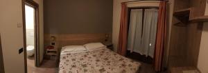 Posteľ alebo postele v izbe v ubytovaní Hotel Piccolo Mondo