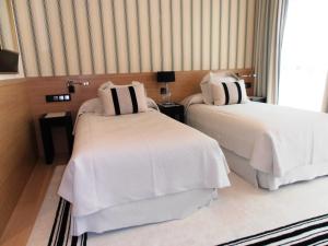 Кровать или кровати в номере Gran Hotel Sardinero