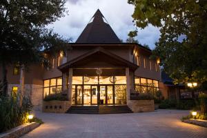 a building with a large building with a pyramid at Session Hotel Ráckeve in Ráckeve