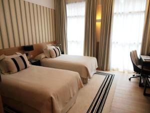 Кровать или кровати в номере Gran Hotel Sardinero