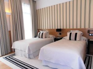 Кровать или кровати в номере Gran Hotel Sardinero