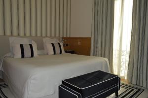 Кровать или кровати в номере Gran Hotel Sardinero